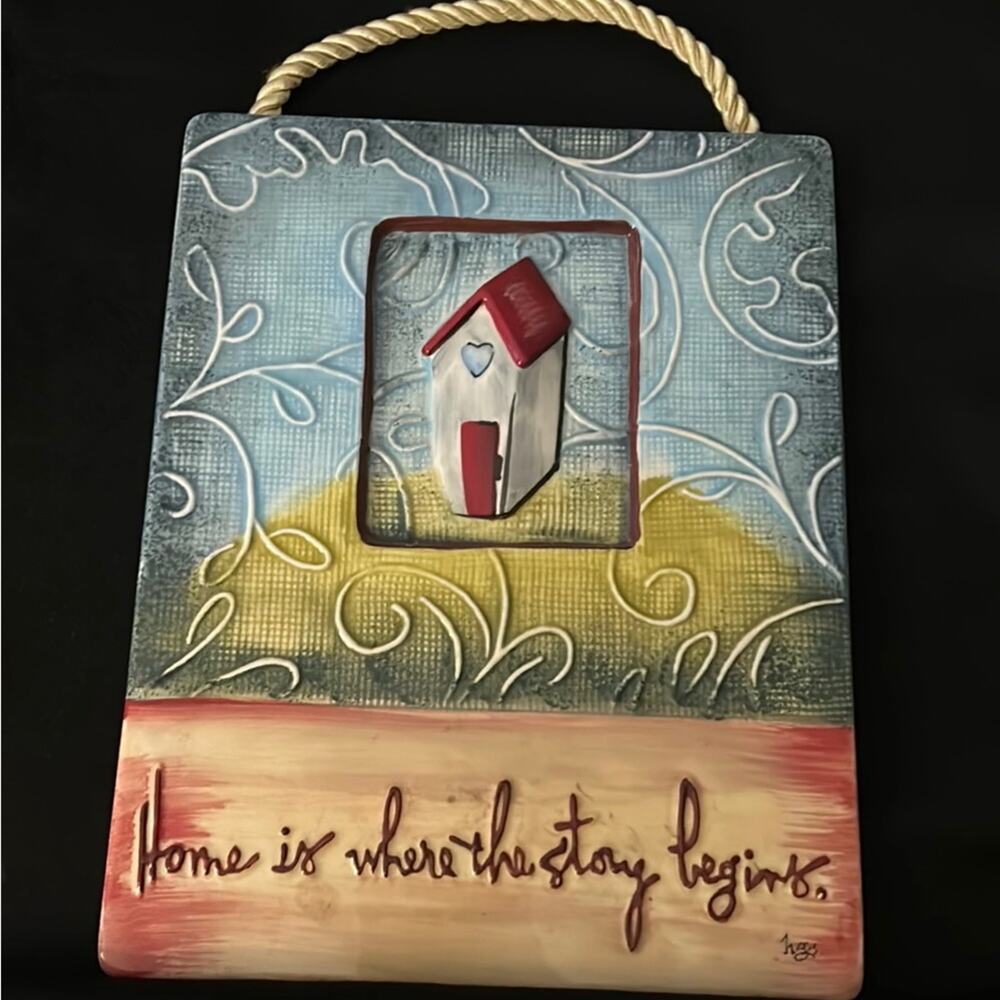 “Home is where the story begins” plaque